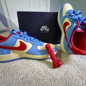 Brand new never worn. Nike Air Force 1 Low Blue and Red Sneakers with red laces.